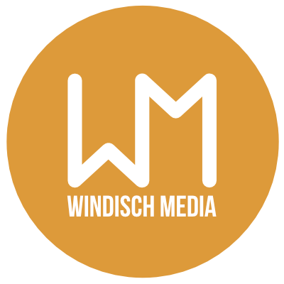 Bild des Logos von Windisch Media. WM in Weiß auf orangenem Kreis.